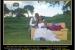 A bajan bride and groom living overseas have their wedding photos taken in the Barbadian fields and hills. 